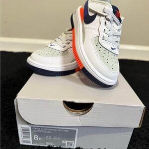 Nike Kids' White and Navy Sneakers with Orange Accents